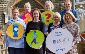 Reward Finance Group and the Sue Ryder team